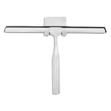 De Zamoro RVS van yessential.nl is een zilverkleurige roestvrijstalen douchewisser met een zwart rubberen blad en bijpassende 3M houder, afgebeeld op een witte achtergrond.