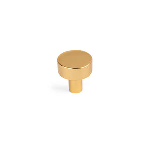 De Stefano Gold Knob is een ronde, goudkleurige kastknop met een korte cilindrische steel, ideaal voor minimalistisch design en perfect als elegante deurknopjes goud. Weergegeven op een witte achtergrond.